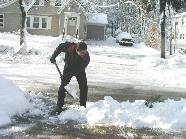 More shoveling.  This is the third time I shoveled out the driveway since the storm started!