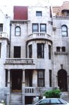 A view of one of the granite rowhouse entryways